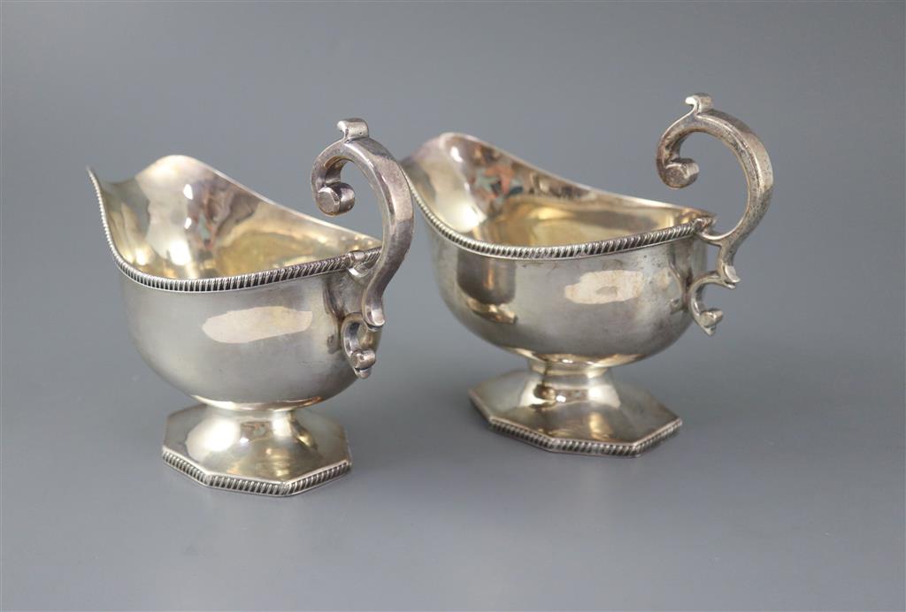 A pair of late Victorian silver pedestal sauceboats, by Roskell, Roskell & Hunt, 22oz.